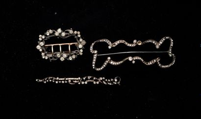 A metal and rhinestone (missing) set in diamond...