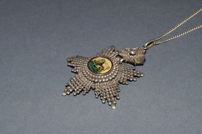 MEDAL in silver min 800/°° featuring the...