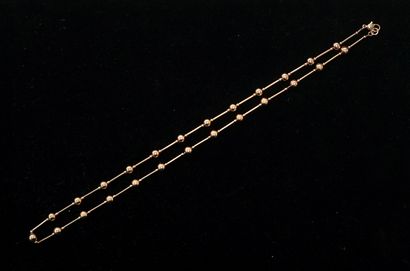 Gold-plated necklace with stick pearls interspersed...