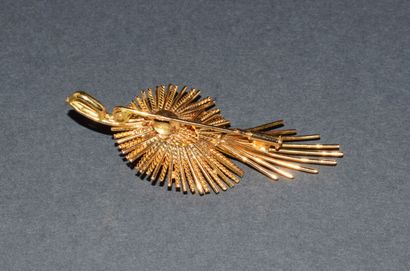 BROCHE en or jaune 18K (750/°°) stylisant...