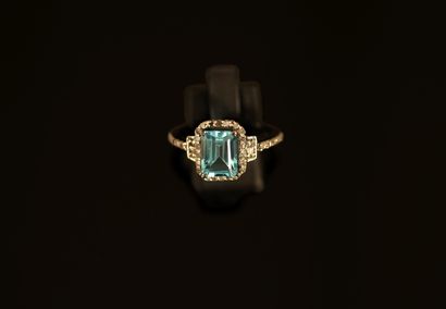 Black patinated silver ring centered on a...