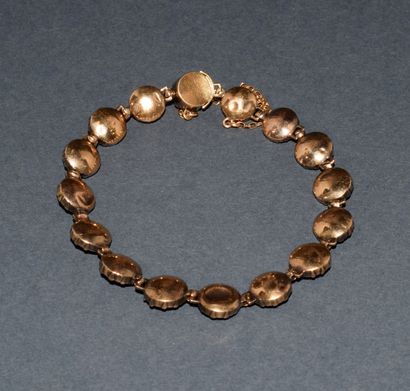 BRACELET in 18K (750/°°) yellow gold adorned...
