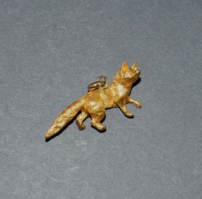 PENDENTIF en or jaune 18K (750/°°) figurant...
