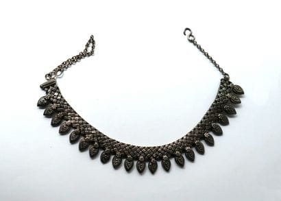 Silver-plated necklace adorned with a series...