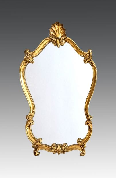 Miroir en bois stuqué et doré chantourné...