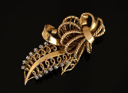 18k (750/°°) yellow gold BROCHURE formed...