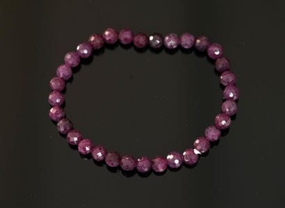 BRACELET composed of round faceted ruby beads...