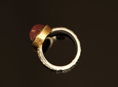 Silver and silver-gilt ring centered on an...