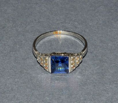 Platinum ring centered on a synthetic sapphire,...