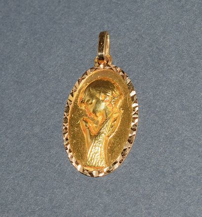 RELIGIOUS MEDAL in 18K (750 /°°) yellow gold,...
