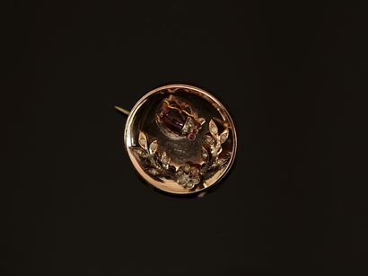 Round rose gold and silver brooch featuring...