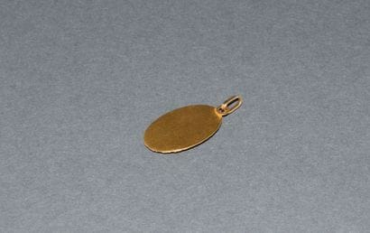 RELIGIOUS MEDAL in 18K (750 /°°) yellow gold,...