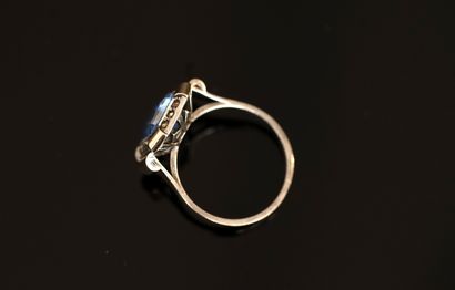 Gold and silver ring centered on a light...