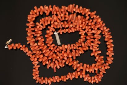 SAUTOIR made of red-orange coral drop beads....