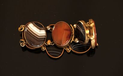 BRACELET in gilded metal, the links embellished...