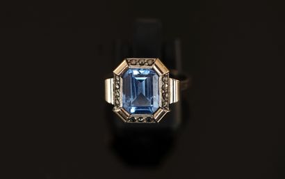 Gold and silver ring centered on a light...