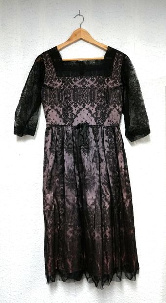 Mid-length cocktail dress in black lace over...