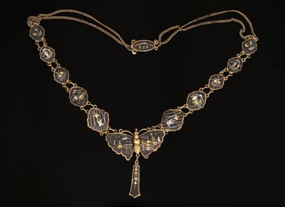 NECKLACE in gilt, silver and iron, the polylobed...