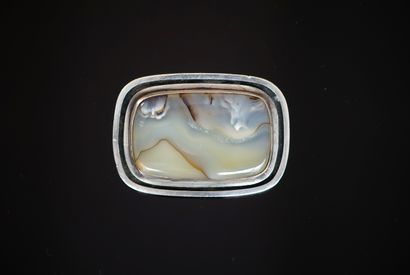 Modernist 800/°° silver brooch holding a...