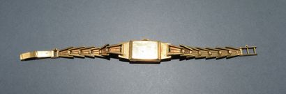 BRACELET WATCH in 18K (750/°°) yellow gold...