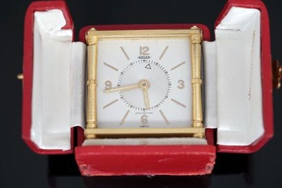 JAEGER - TRAVEL ALARM CLOCK in gilt metal...