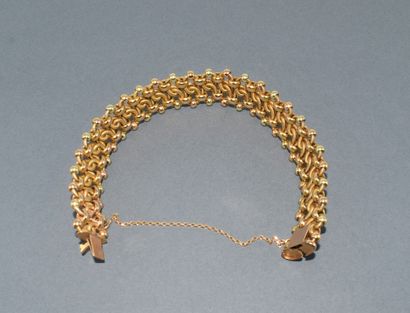 BRACELET in 18K (750/°°) yellow gold, hallmarked...