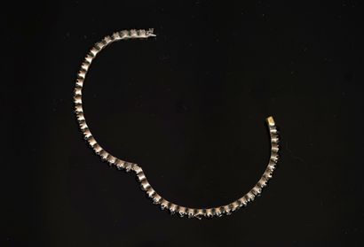 BRACELET in gilded metal set with faceted...