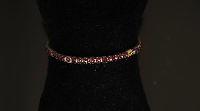 BRACELET in gilded metal set with faceted...