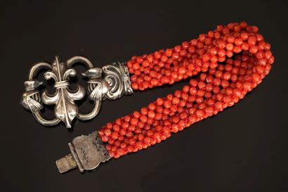 BRACELET made of small braided orange-red...