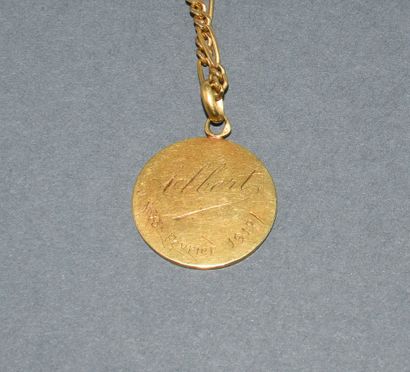 CHAIN AND MEDAL in 18K (750/°°) yellow gold...