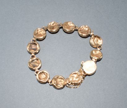 BRACELET in 18K (750/°°) yellow gold, horse...