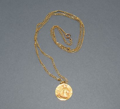 CHAIN AND MEDAL in 18K (750/°°) yellow gold...