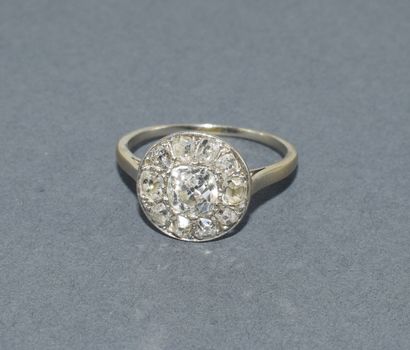 Round platinum ring set with old-cut diamonds...