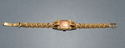 BRACELET WATCH in 18K (750/°°) yellow gold...