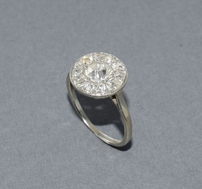 Round platinum ring set with old-cut diamonds...