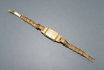 BRACELET WATCH in 18K (750/°°) yellow gold...