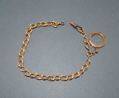 CHAINE giletière en or jaune 18K (750/°°)...
