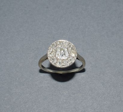 Round platinum ring set with old-cut diamonds...