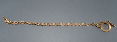 CHAINE giletière en or jaune 18K (750/°°)...