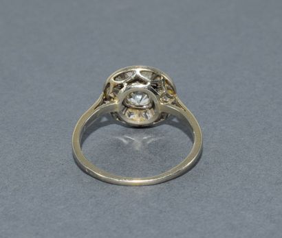 Round platinum ring set with old-cut diamonds...