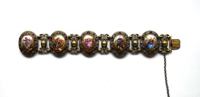 BRACELET en métal argenté et doré, les maillons...