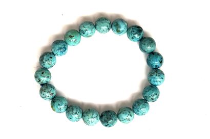 BRACELET composé de perles rondes de turquoise...