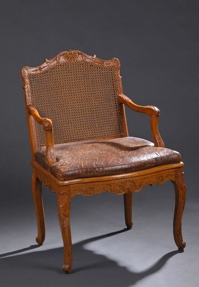 * Louis XV period caned armchair 
In molded...