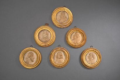 * Six carved alabaster medallions depicting...