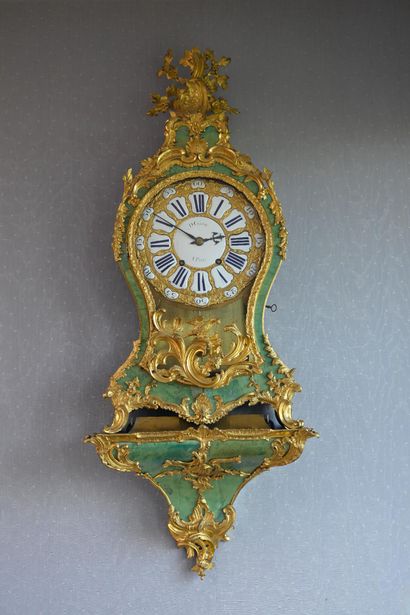 * Large Louis XV period cartel 
In green...