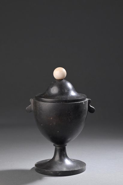 * Covered vase 
On pedestal in Belgian black...