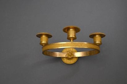 * Empire period wall lamp
In gilded bronze...
