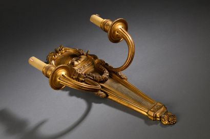 Louis XVI-style ormolu two-arm sconce.
Decorated...