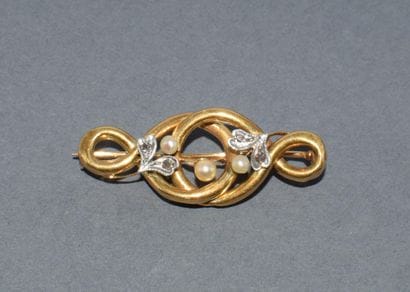 BROCHE en or jaune 18k (750/°°) figurant...