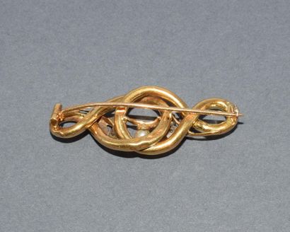 BROCHE en or jaune 18k (750/°°) figurant...